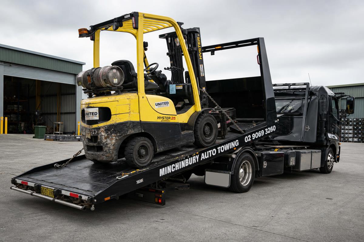 Forklift loaded on a Minchinbury Auto Towing heavy duty tilt tray truck